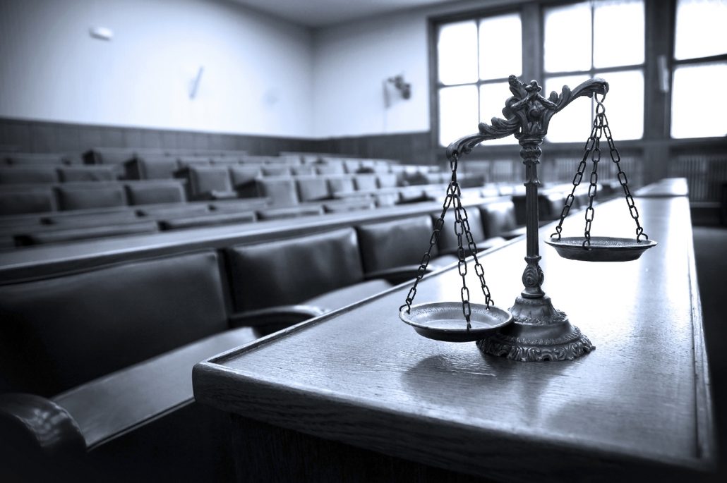 Symbol of law and justice in the empty courtroom law and justice concept blue tone